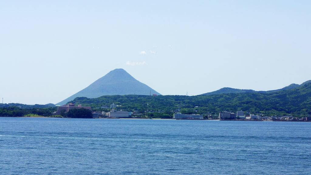 Ibusuki hot spring town and Kaimondake volcano. Taken from the ferry Mishima ship.